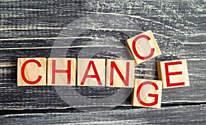 Wooden cube with word `change` to `chance` on wood table. Personal development and career growth or change yourself concept. conce