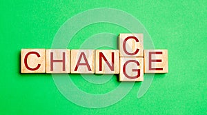 Wooden cube with word `change` to `chance` on wood table. Personal development and career growth or change yourself concept. conce