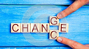 Wooden cube with word `change` to `chance` on wood table. Personal development and career growth or change yourself concept. conce photo