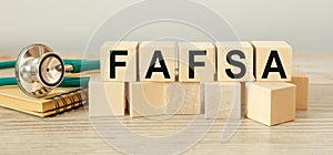 Wooden cubes with the abbreviation FAFSA photo