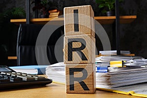 Wooden cubes with abbreviation IRR internal rate of return.