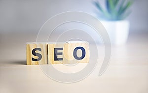 Wooden cubes with the acronym SEO for search engine optimization