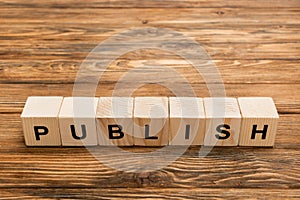 wooden cubes with black publish inscription