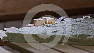 Wooden cubes at a construction site. Glass fiber in the foreground