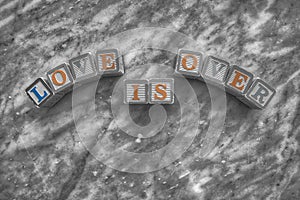 Wooden cubes engraved with modular letters to form sentences on a marble background photo