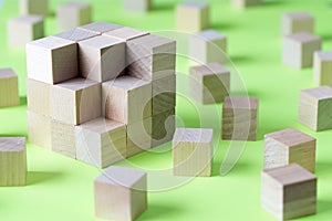 Wooden cubes form a bigger square