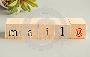 Wooden cubes with the inscription spelling mail with the dog symbol