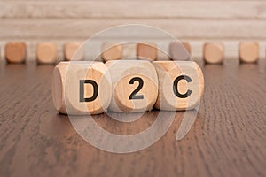 wooden cubes with the letters d2c on them