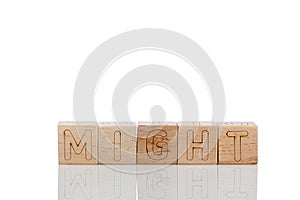 Wooden cubes with letters might on a white backgroun