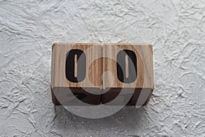 Wooden cubes with numbers on a white crumpled background. 00