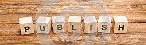 wooden cubes with publish inscription on