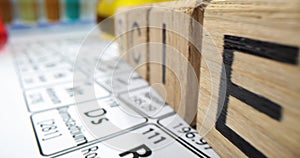 Wooden cubes in row on desk creating word Science in office