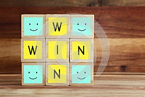 Wooden cubes stack with the text win-win-situation. Strategy and business concept