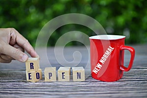 Wooden cubes with text. Adapting to new life or business post-lockdown after coronavirus pandemic.