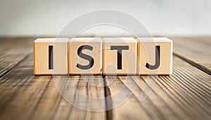 Wooden cubes with text ISTJ. Introversion, Sensing, Thinking, Judging. Personality type. Close-up