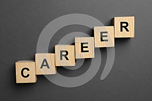 Wooden cubes with word CAREER on background, flat lay