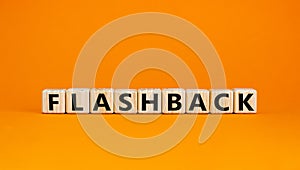 Wooden cubes with word `flashback`. Beautiful orange background. Business and educational concept. Copy space photo