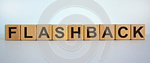 Wooden cubes with word `flashback`. Beautiful white background. Business and educational concept. Copy space