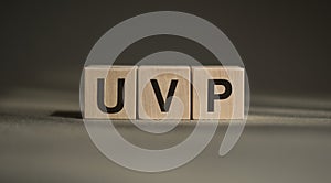 Wooden cubes with word UVP - short for Unique Value Proposition