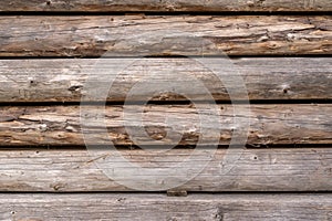 Wooden cut logs stacked in pile