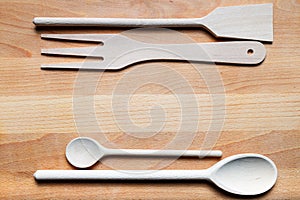 Wooden cutlery on cutting board