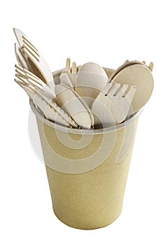 Wooden cutlery in a paper cup. Disposable accessories used in fast food restaurants