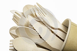 Wooden cutlery in a paper cup. Disposable accessories used in fast food restaurants