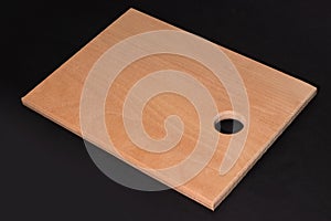 Wooden cutting board on darck background