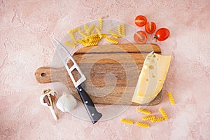 Wooden cutting board and fresh ingredients for cooking