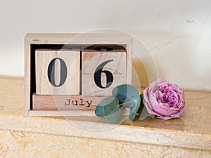 Wooden date cubes showing July 6