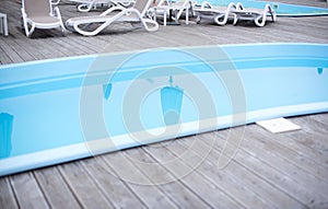 Wooden deck beach sea ocean resort sun lounger umbrella hotel pool sky sunrise.