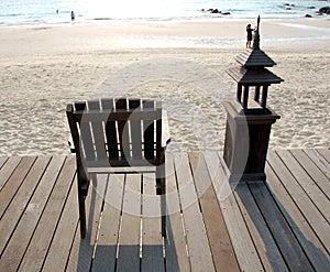 Wooden Deck Chair Facing Sea