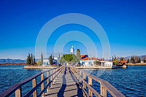 Wooden deck leading to the Saint Nikolas monastery in Porto Lagos.