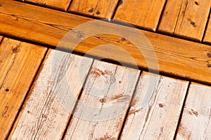 Wooden deck pattern partially stained transparent