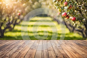 Wooden deck table with an apple orchard blurred background.