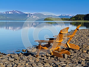 Wooden deckchairs overlooking scenic Lake Laberge