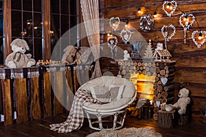 Wooden decorative fireplace, papasan chair and romantic bulbs