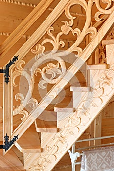 Wooden, decorative hand carved staircase detail