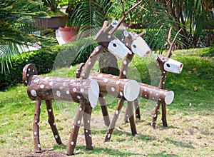 A wooden deer family