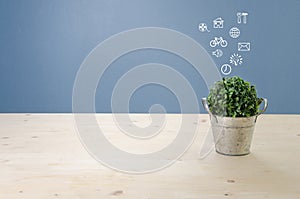 Wooden desk with dried tree on basket and white symbol, View fro