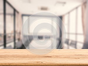 Wooden desk with office background