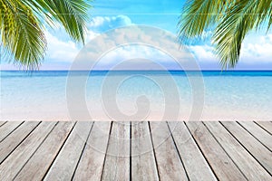 Wooden desk or plank on sand beach in summer. background.