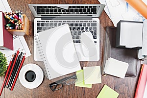 Wooden desk top with office items and devices