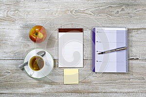 Wooden Desktop with Business Objects and snack food