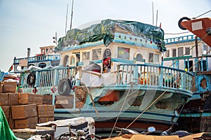 Wooden dhow cargo boats loaded with merchandise on Dubai Creek, UAE