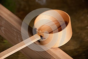 Wooden dipper of holy zen water in Japan Shinto temple