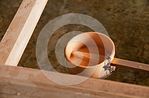 Wooden dipper of holy zen water in Japan Shinto temple