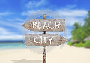 Wooden direction sign beach or city