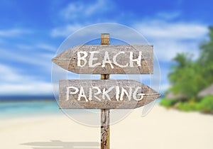 Wooden direction sign beach or parking