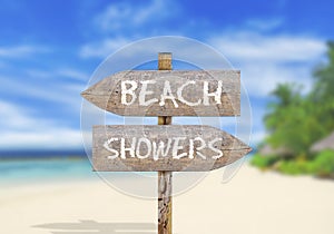 Wooden direction sign beach or showers